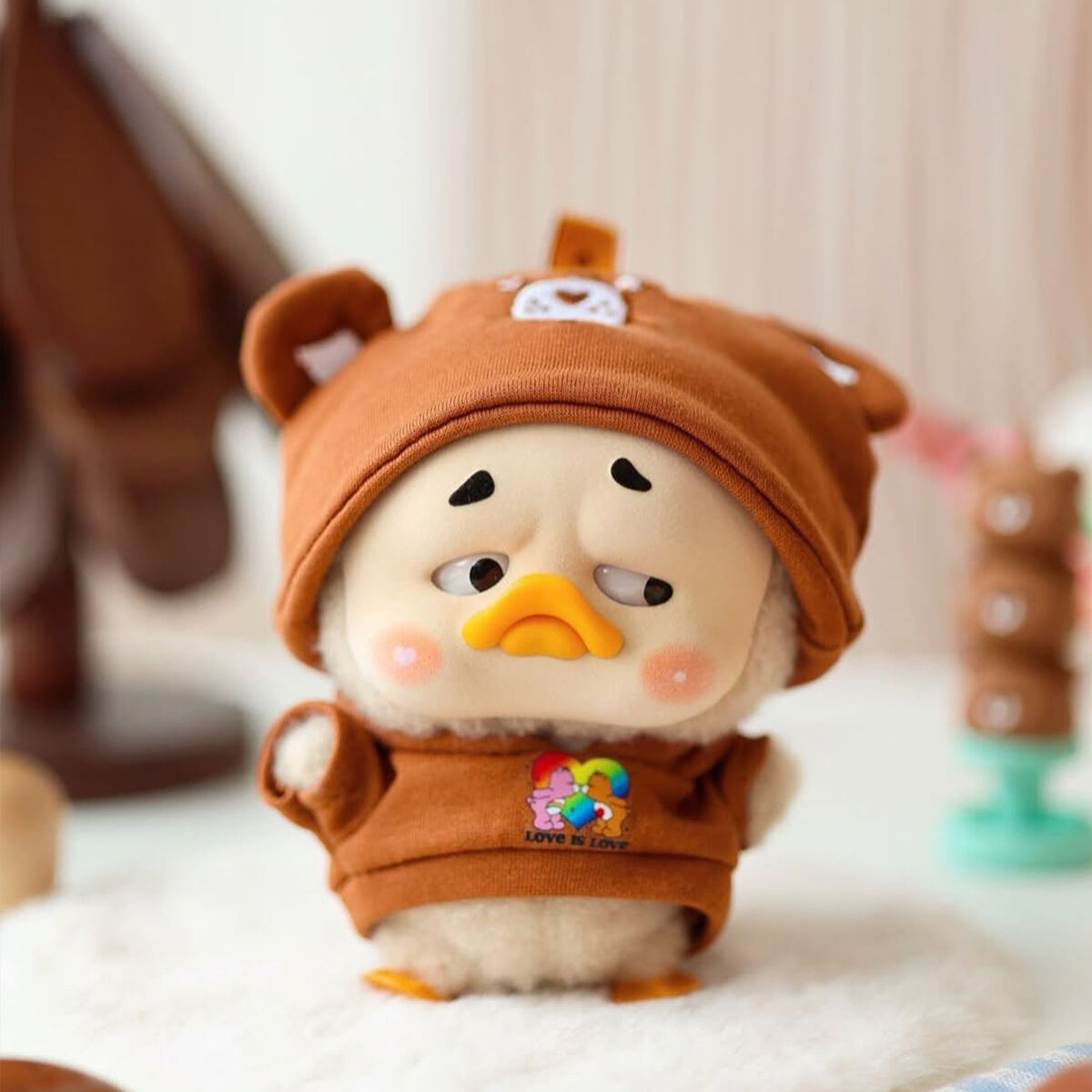 Колекційна м'яка іграшка з кільцем POP TOP 1983toys серії "Upset Duck x Care Bears" - БУДЬ ВЕСЕЛКОЮ (у дисп., в ас.)